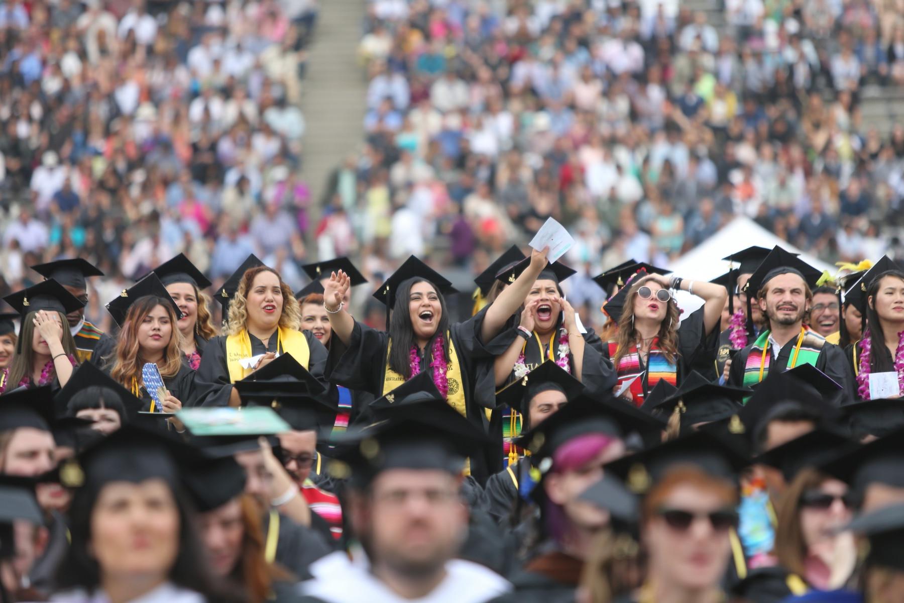 Student cheering at comencement