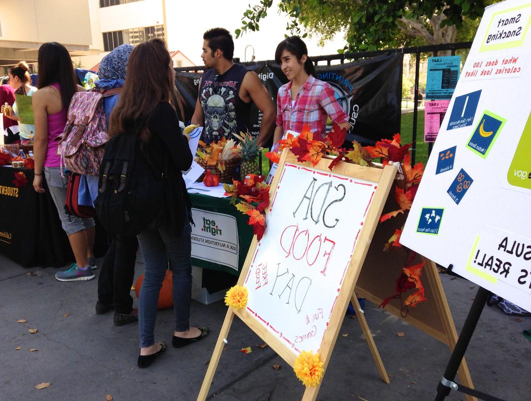 Students handing out nutrition information on campus