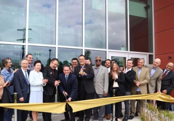 county officials and staff pose for ribbon ceremony 