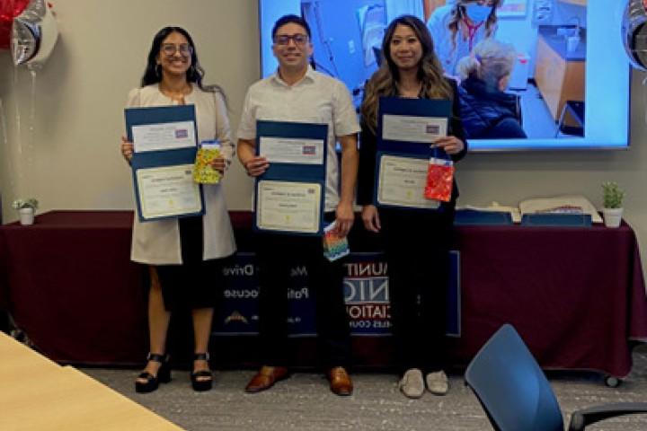 Cohort #2 posing with their certificates. 