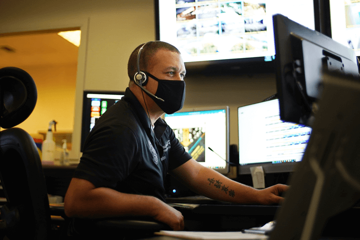 Dispatch surrounded by computer screens