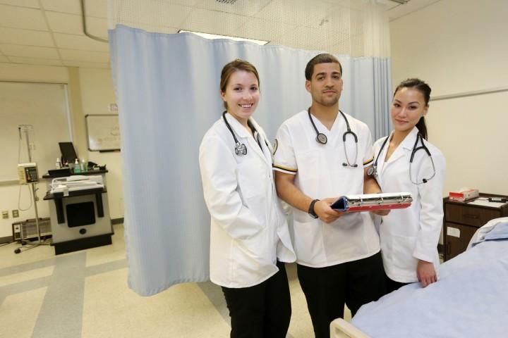 Three students in the simulation lab. 