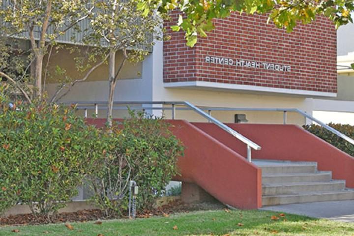 Exterior of a brick building labeled Student Health Center.