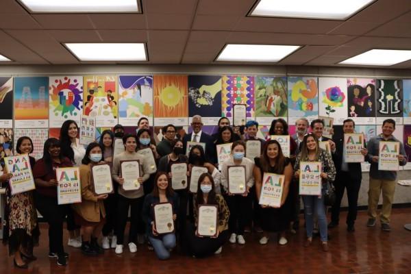 LA For All Student Showcase Students in front of their work